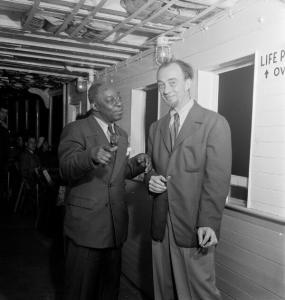 New Orleans drummer Warren “Baby” Dodds and Rudi Blesh on a Hudson River boat, circa July 1947. (photo by William P. Gottlieb)