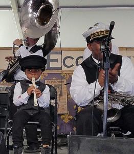 Treme Brass Band – The “Future of Fest” – toddler Kingston Wiley on recorder and his dad, Cedric, on saxophone. (photo by Ken Arnold)