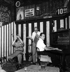 Bret Runkle at Monkey Inn with Scheelar and Erickson. Note the sophomoric collegiate décor. Photo by William Carter, 1962.