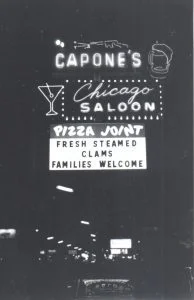 Capones neon sign at night