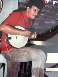 Clint with his first banjo, 1986